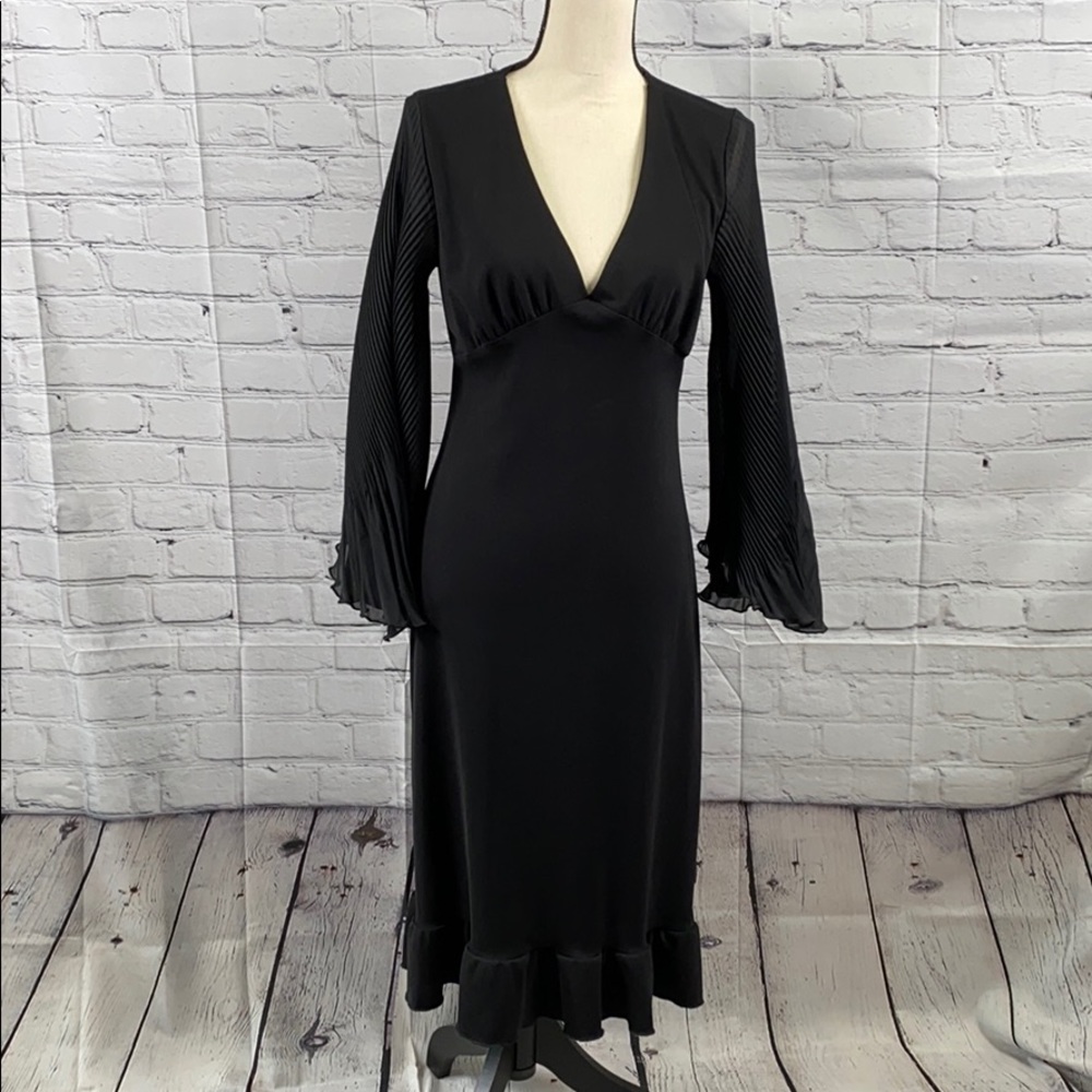 Pretty and unique black dress.